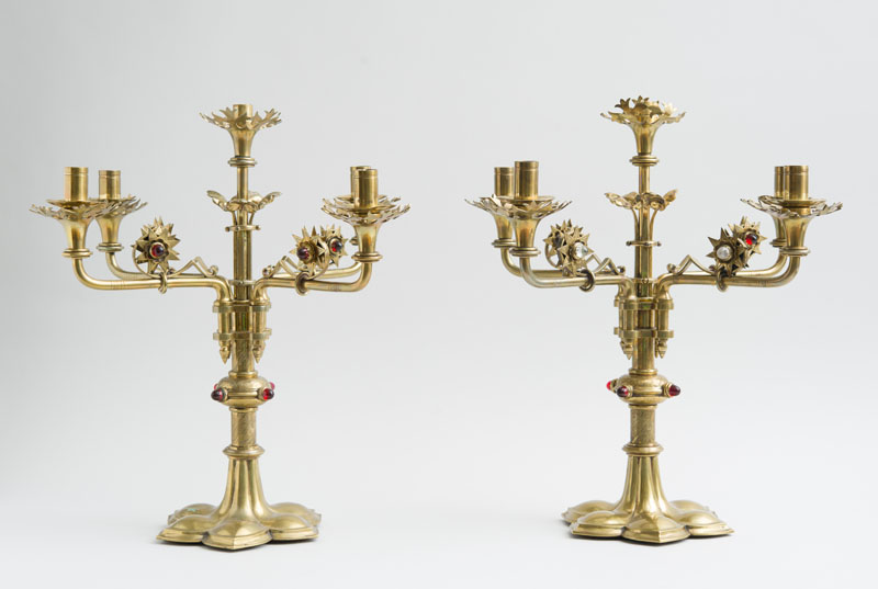 Appraisal: STYLE OF A W N PUGIN PAIR OF CANDELABRA Brass