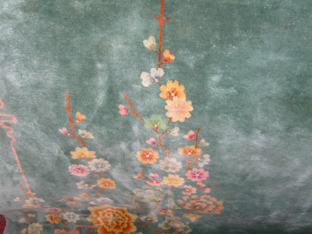 Appraisal: A heavy Chinese wool carpet with green ground and floral