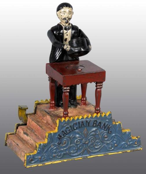 Appraisal: Cast Iron Magician Mechanical Bank Description Manufactured by J E