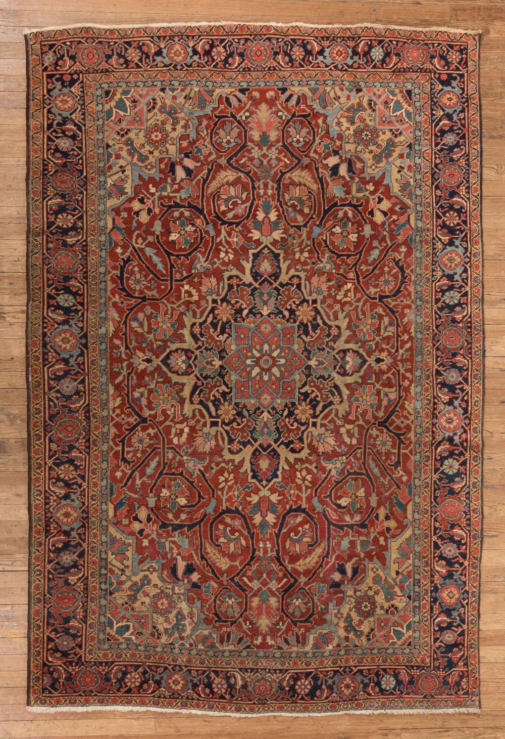 Appraisal: Antique Heriz Carpet red ground central medallion allover foliate design