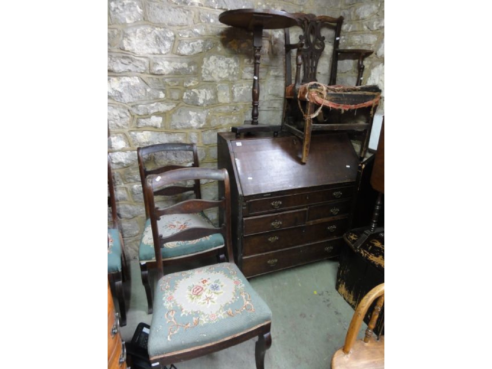 Appraisal: A Georgian mahogany bureau the fall front enclosing a fitted