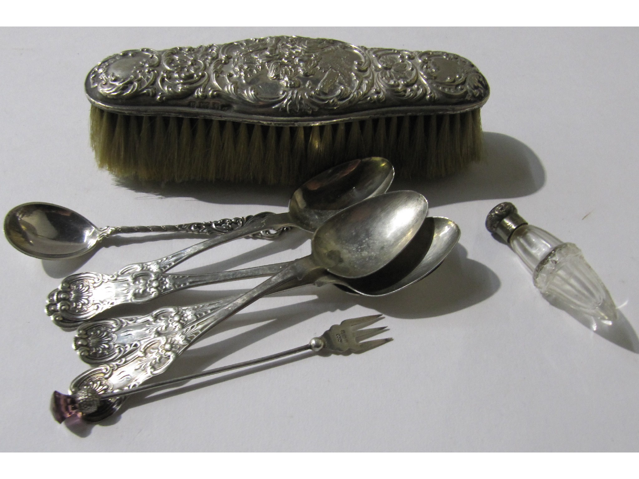 Appraisal: A lot comprising a silver brush and some silver spoons