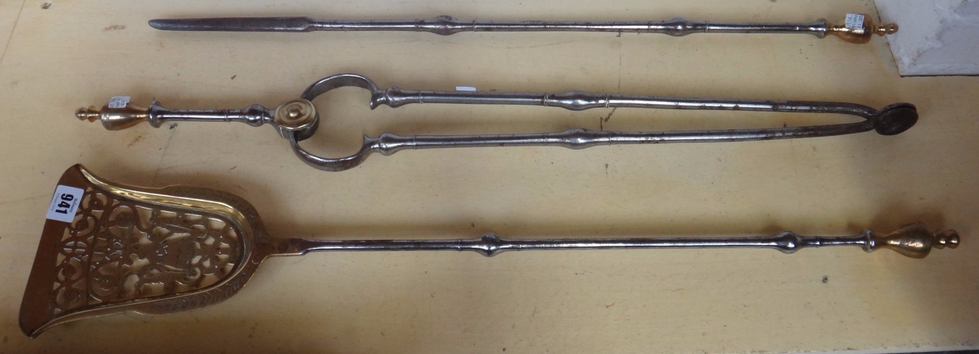 Appraisal: A set of three steel and brass mounted fire tools