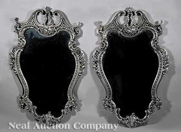 Appraisal: A Pair Louis XV-Style Silvered Bronze Mirrors broken arch crests