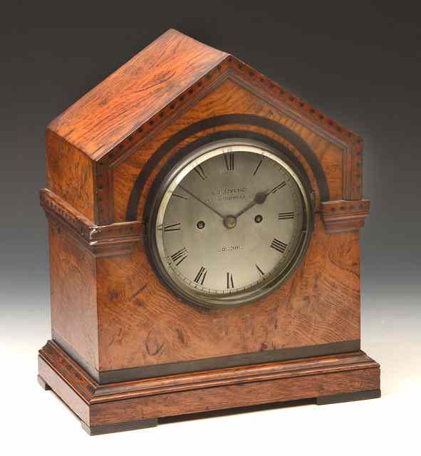 Appraisal: A VICTORIAN OAK MANTEL CLOCK having a silvered Roman dial