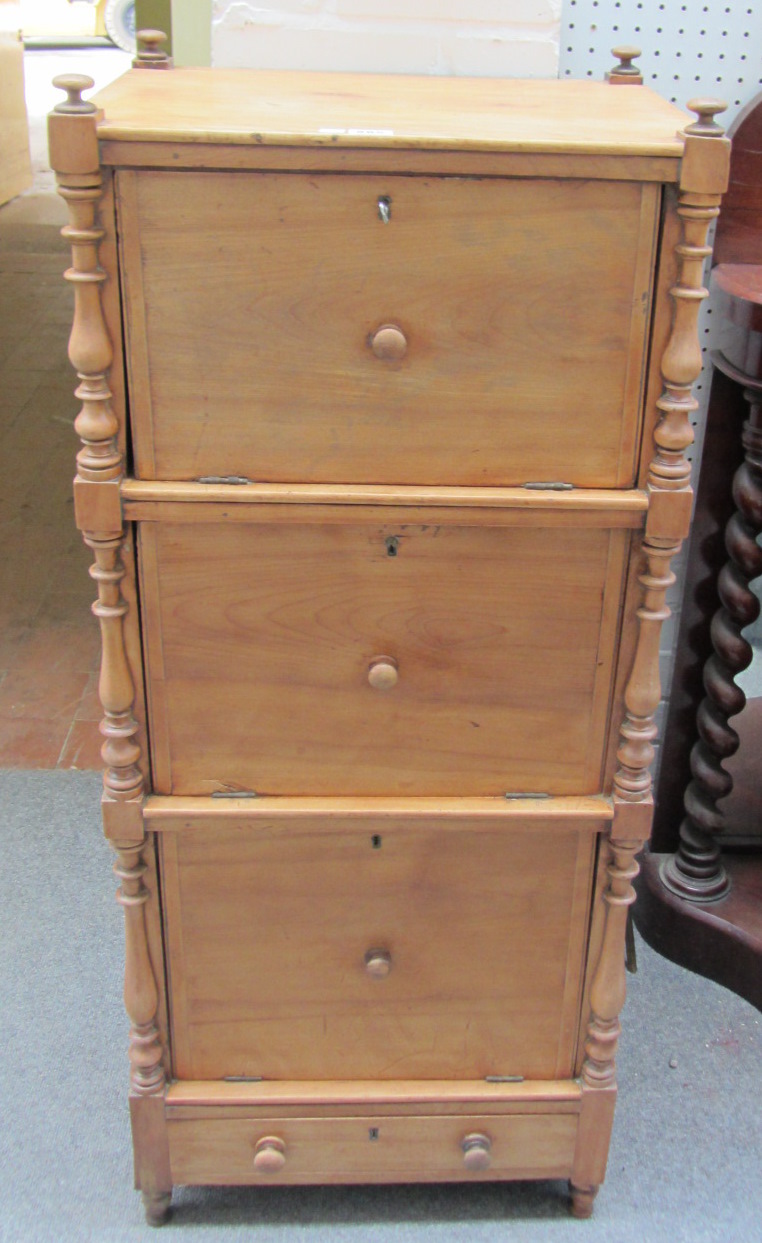 Appraisal: A th century bleached mahogany three tier locker what-not with