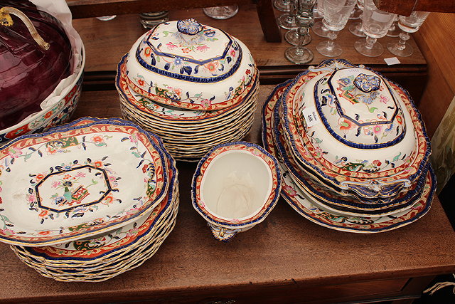 Appraisal: AN OLD MASONS IRONSTONE PART DINNER SERVICE decorated with a