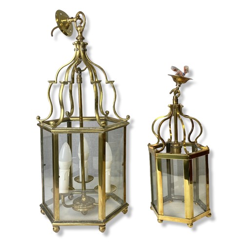 Appraisal: Two Georgian type Polished Brass Hall lanterns One with three