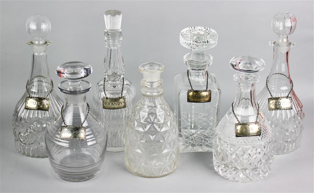 Appraisal: SEVEN CUT AND MOLDED GLASS DECANTERS WITH SIX STIEFF SILVER