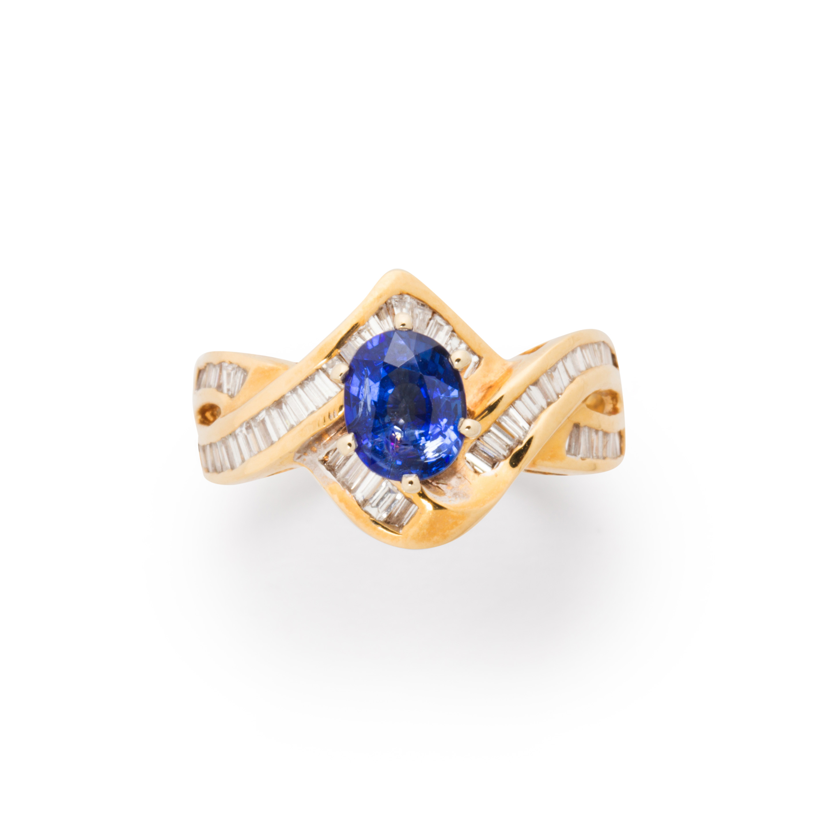 Appraisal: A SAPPHIRE DIAMOND AND EIGHTEEN KARAT GOLD RING A sapphire