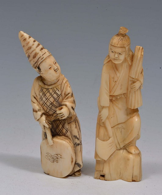 Appraisal: A JAPANESE CARVED IVORY OKIMONO in the form of a