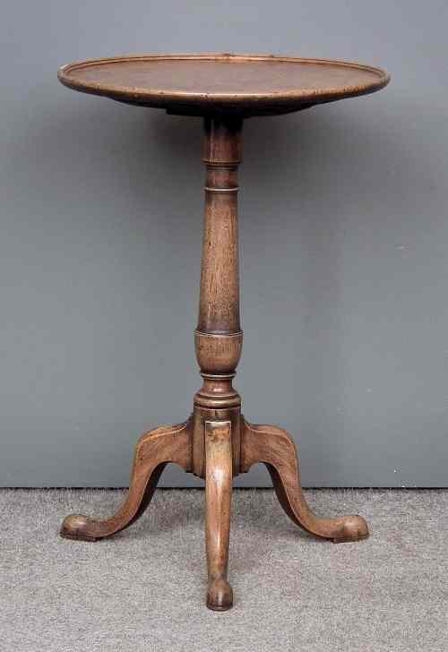 Appraisal: A George III mahogany circular tripod table the top with