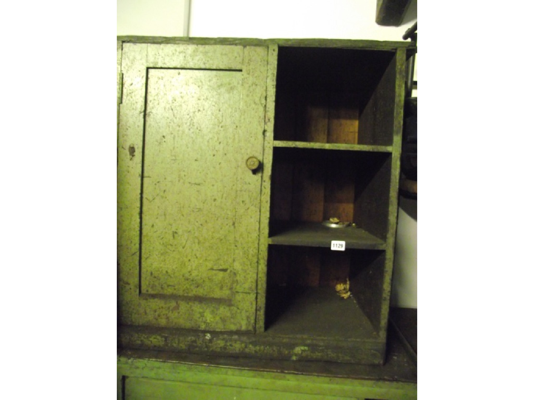 Appraisal: A green painted pine framed floorstanding side cupboard enclosed by