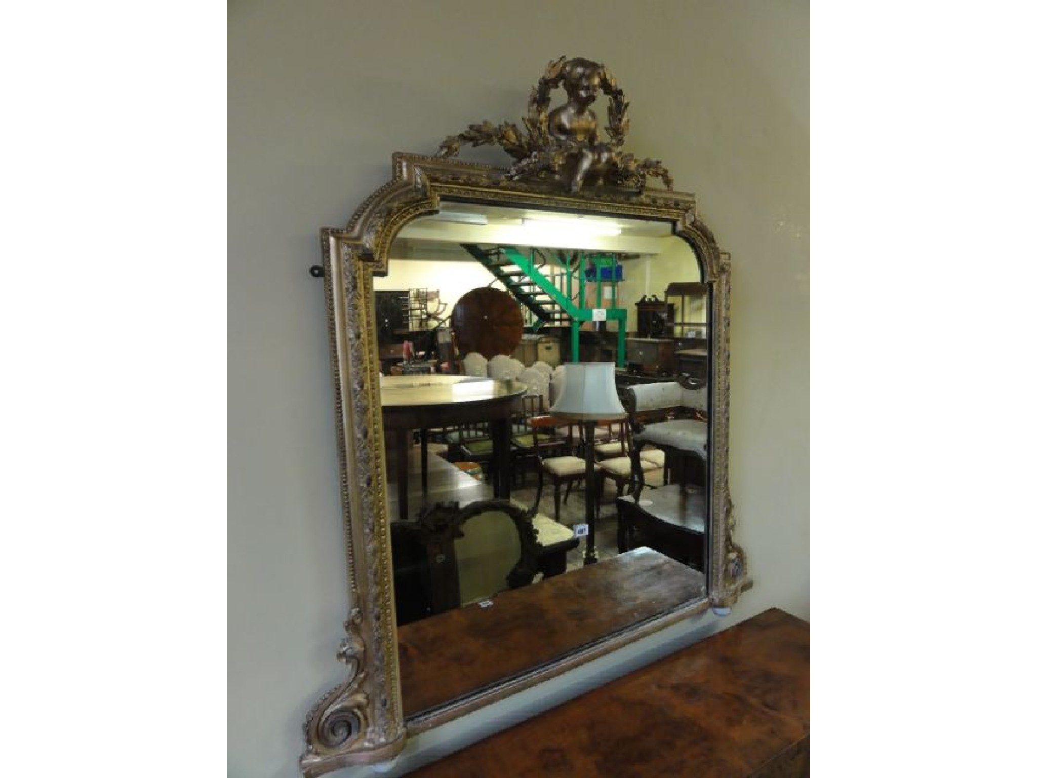 Appraisal: A mid th century overmantel mirror of arched form the