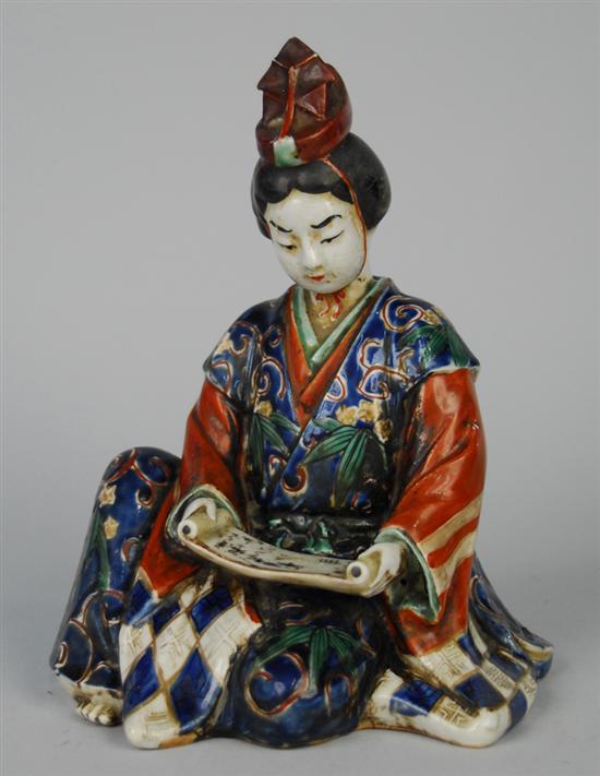 Appraisal: JAPANESE SEATED POLYCHROME GLAZED FIGURE OF A WOMAN READING SCROLL