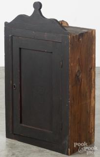 Appraisal: Stained pine hanging cupboard th c with a lollipop crest