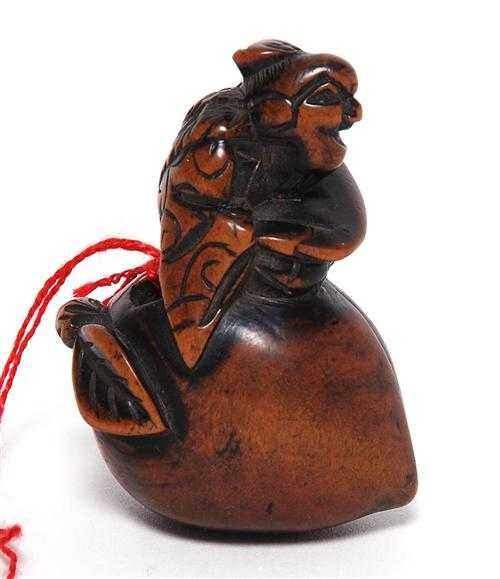 Appraisal: NETSUKE OF A SENNIN Japan th century H cm Wood