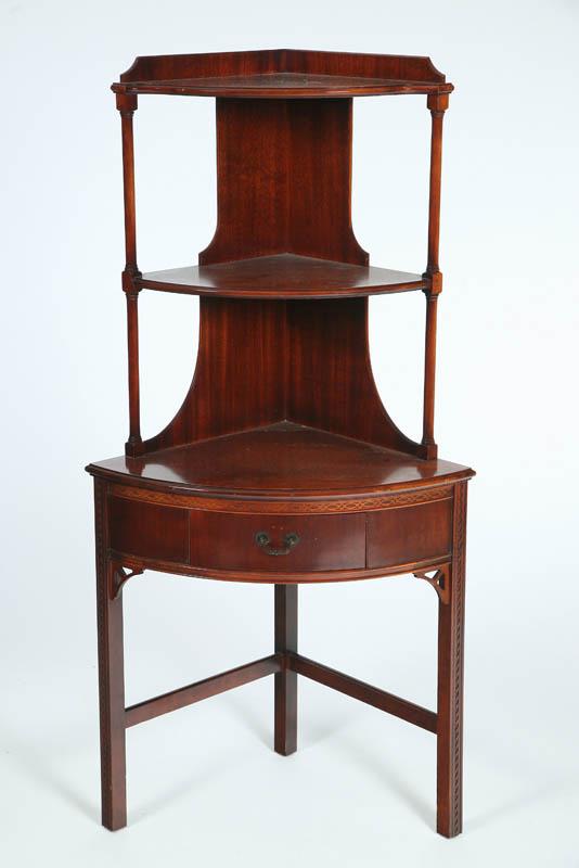 Appraisal: CORNER STAND Mahogany with three shelves and central drawer on