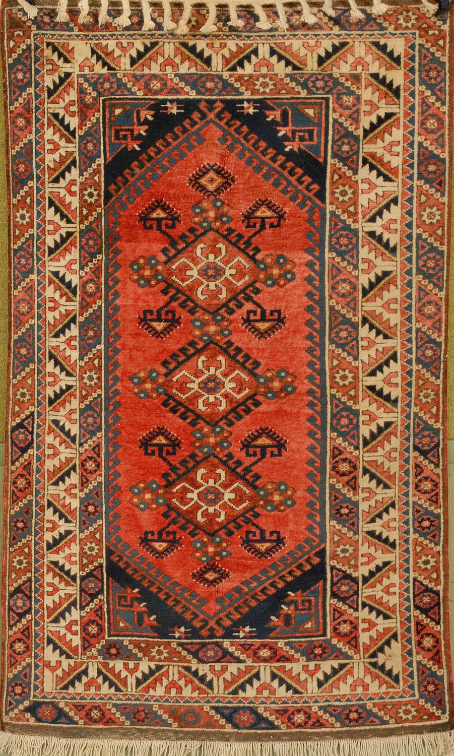 Appraisal: ORIENTAL RUG KAZAK DESIGN ' x ' Three diamond-shaped medallions