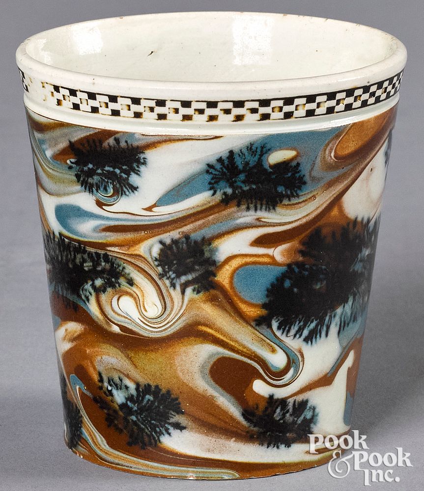 Appraisal: Mocha cup Mocha cup with seaweed decoration on a marbleized