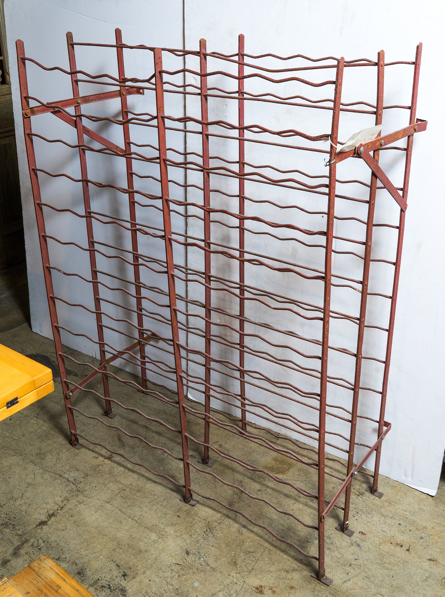 Appraisal: AN EARLY th CENTURY FRENCH WINE RACK Red painted wrought