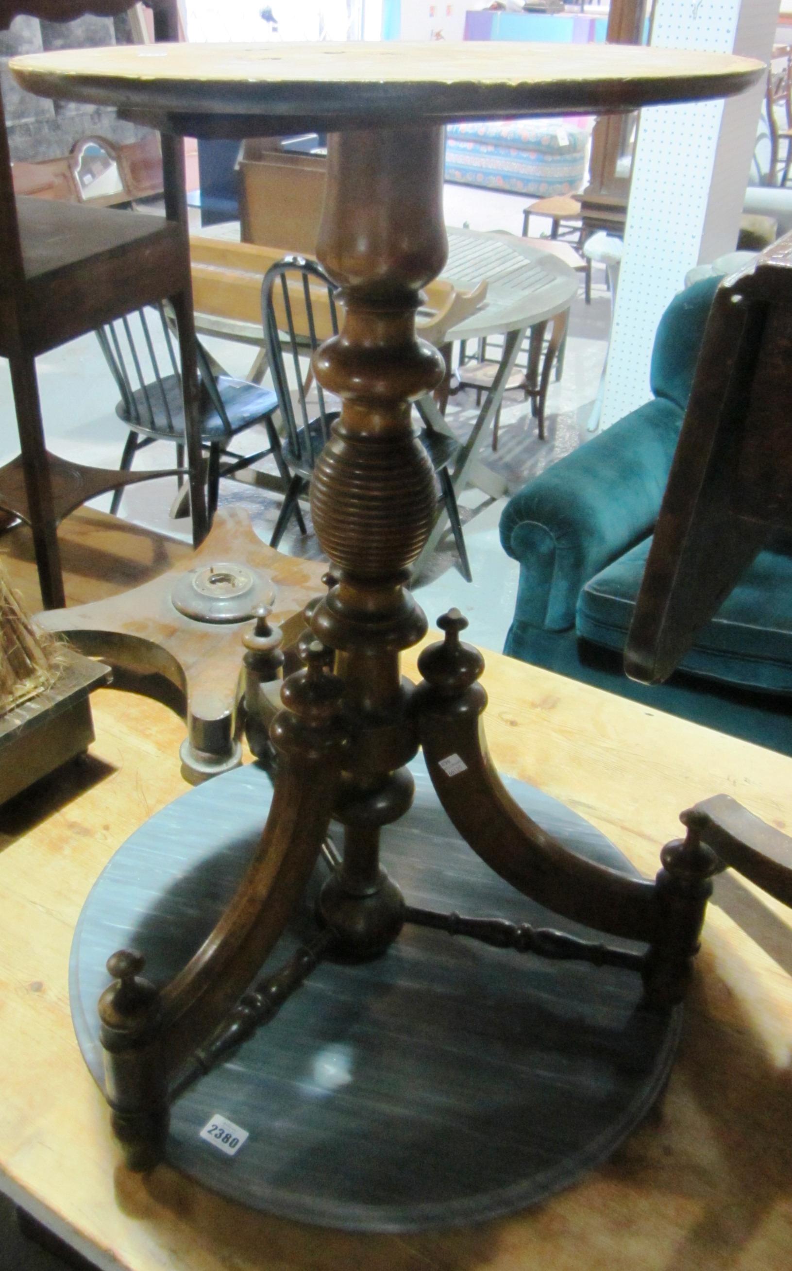 Appraisal: A th century walnut aesthetic style circular occasional table with