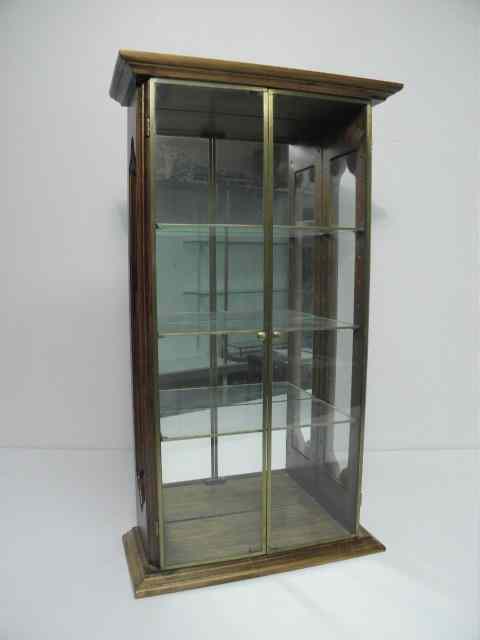 Appraisal: Small four tier wall curio by StudioCraft Pecan wood construction