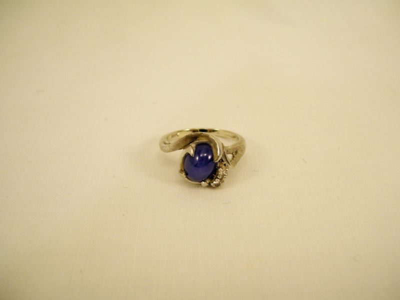 Appraisal: kt White Gold Sapphire Ring Two single cut diamonds and