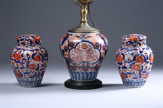 Appraisal: PAIR JAPANESE IMARI PORCELAIN FLUTED JARS AND COVERS late Meiji