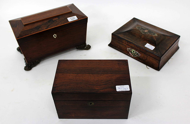 Appraisal: A VICTORIAN ROSEWOOD TEA CADDY of sarcophagus form with fitted