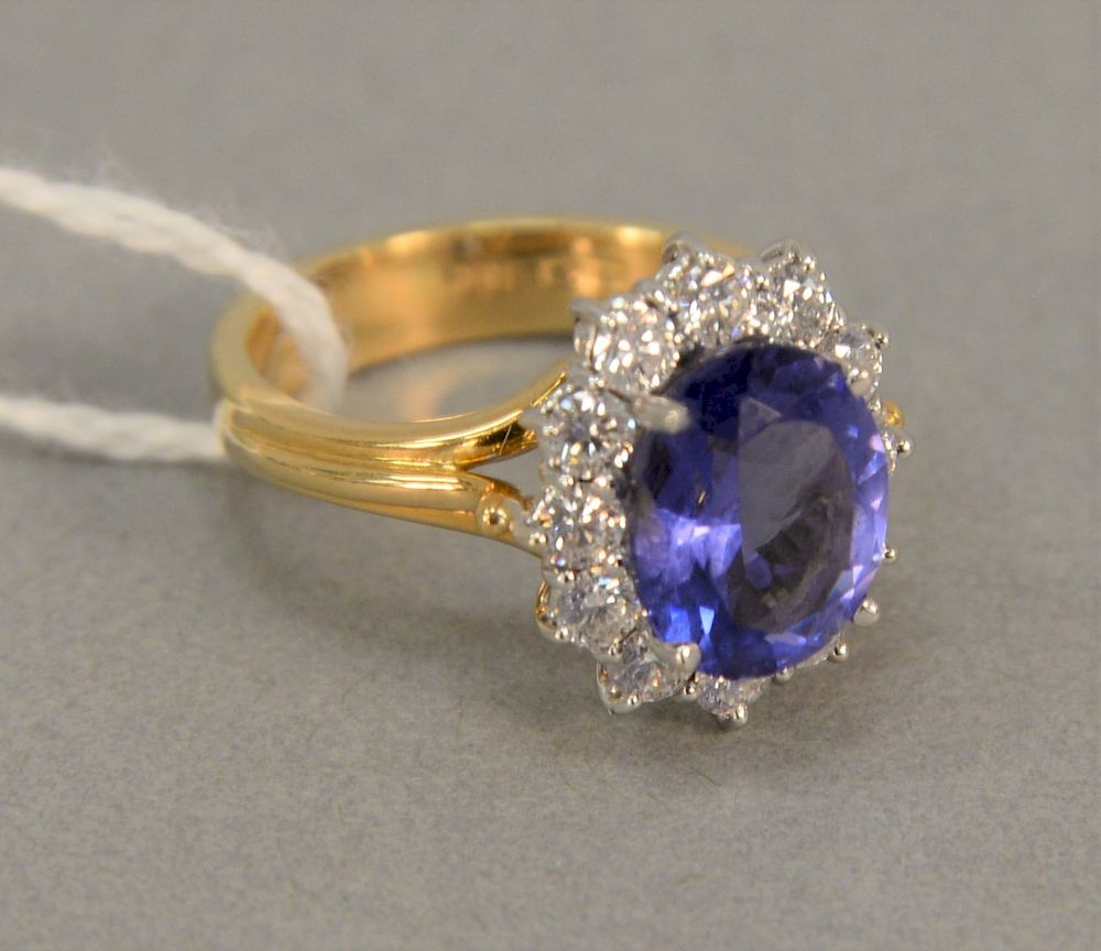 Appraisal: K gold ring set with oval center Tanzanite surrounded by