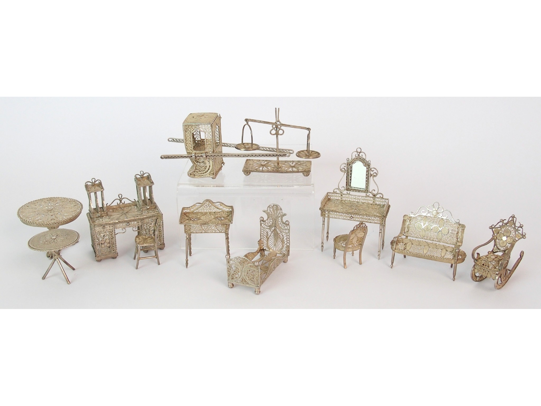 Appraisal: A collection of Eastern filigree white metal furniturecomprising dressing table