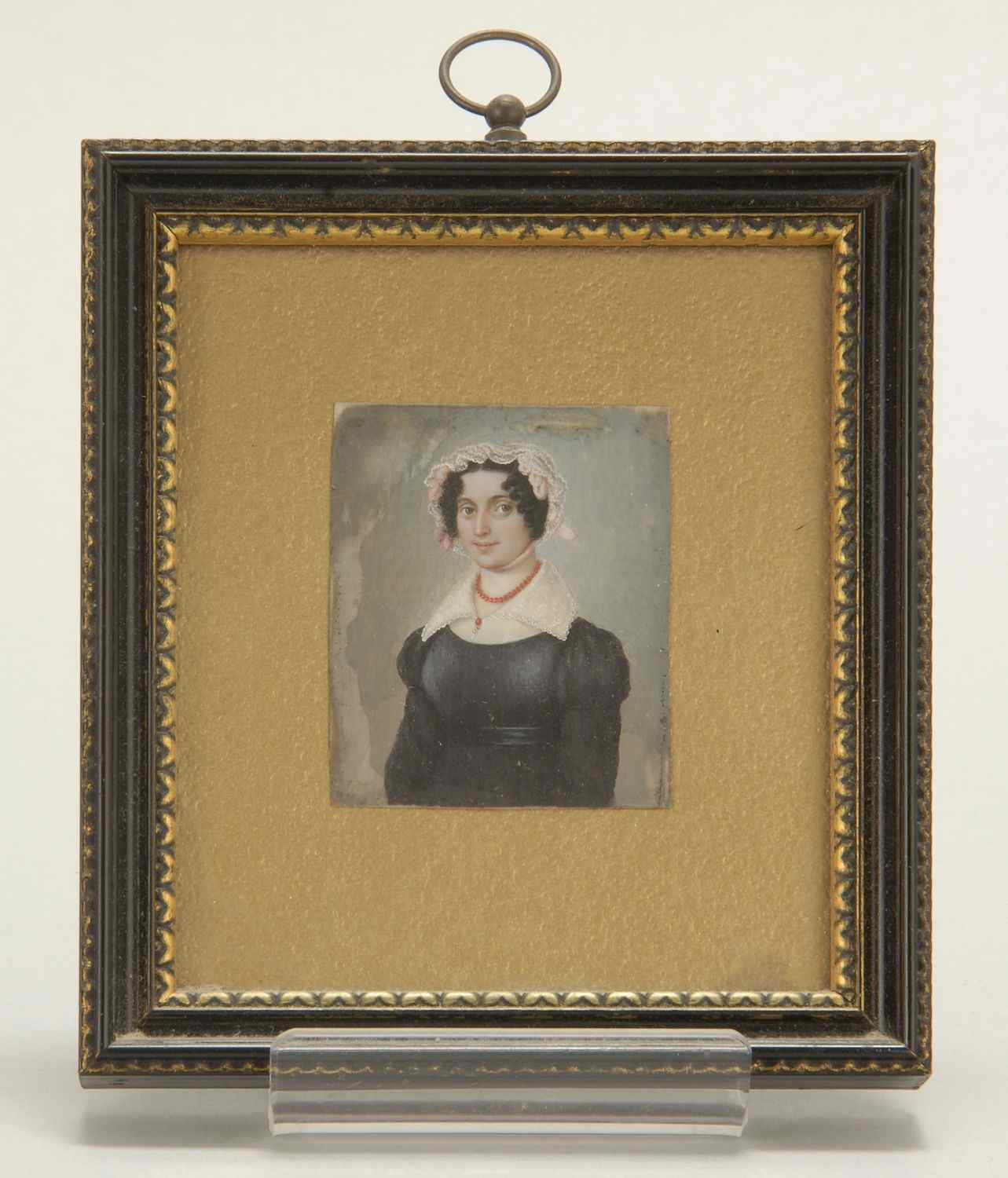 Appraisal: FRAMED MINIATURE PORTRAIT ON IVORYCirca Depicting a young woman wearing