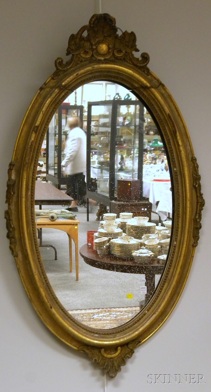 Appraisal: Victorian Oval Rococo Revival Giltwood and Gesso Mirror losses lg