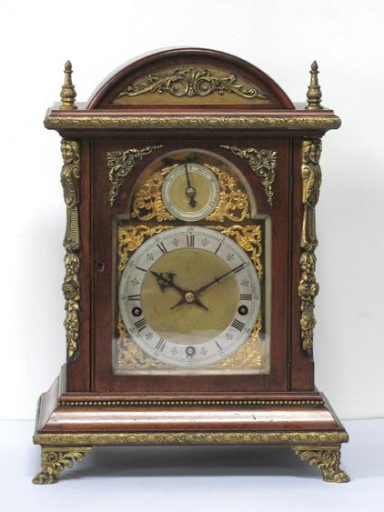 Appraisal: AN EDWARDIAN GILT METAL MOUNTED BRACKET CLOCK the gilt dial