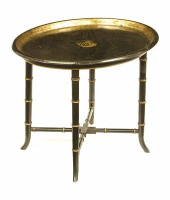 Appraisal: A Victorian japanned tole tray on a later stand with