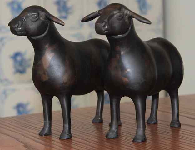 Appraisal: A PAIR OF BRONZE SCULPTURES OF SHEEP long