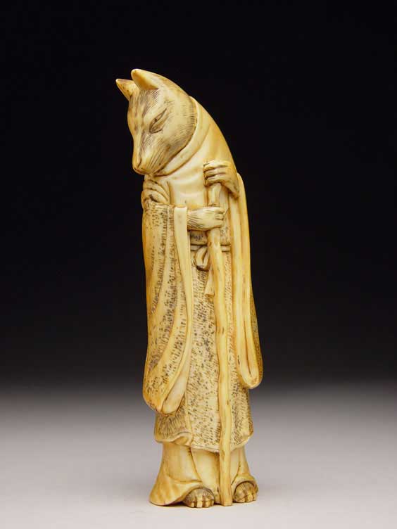 Appraisal: ANTIQUE IVORY NETSUKE Antique and well carved ivory netsuke of