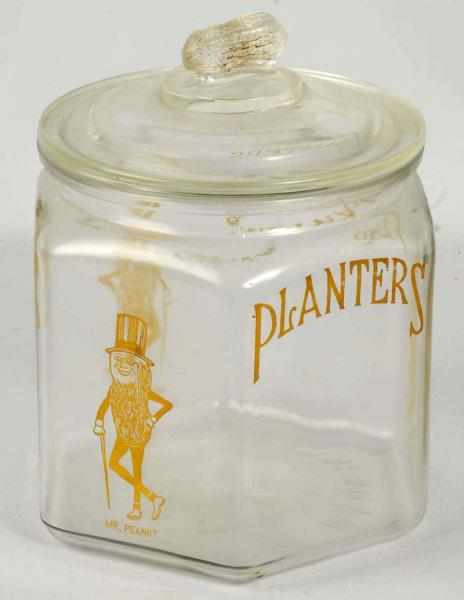 Appraisal: Hexagonal Planters Peanut Jar Description Nice remaining applied color label