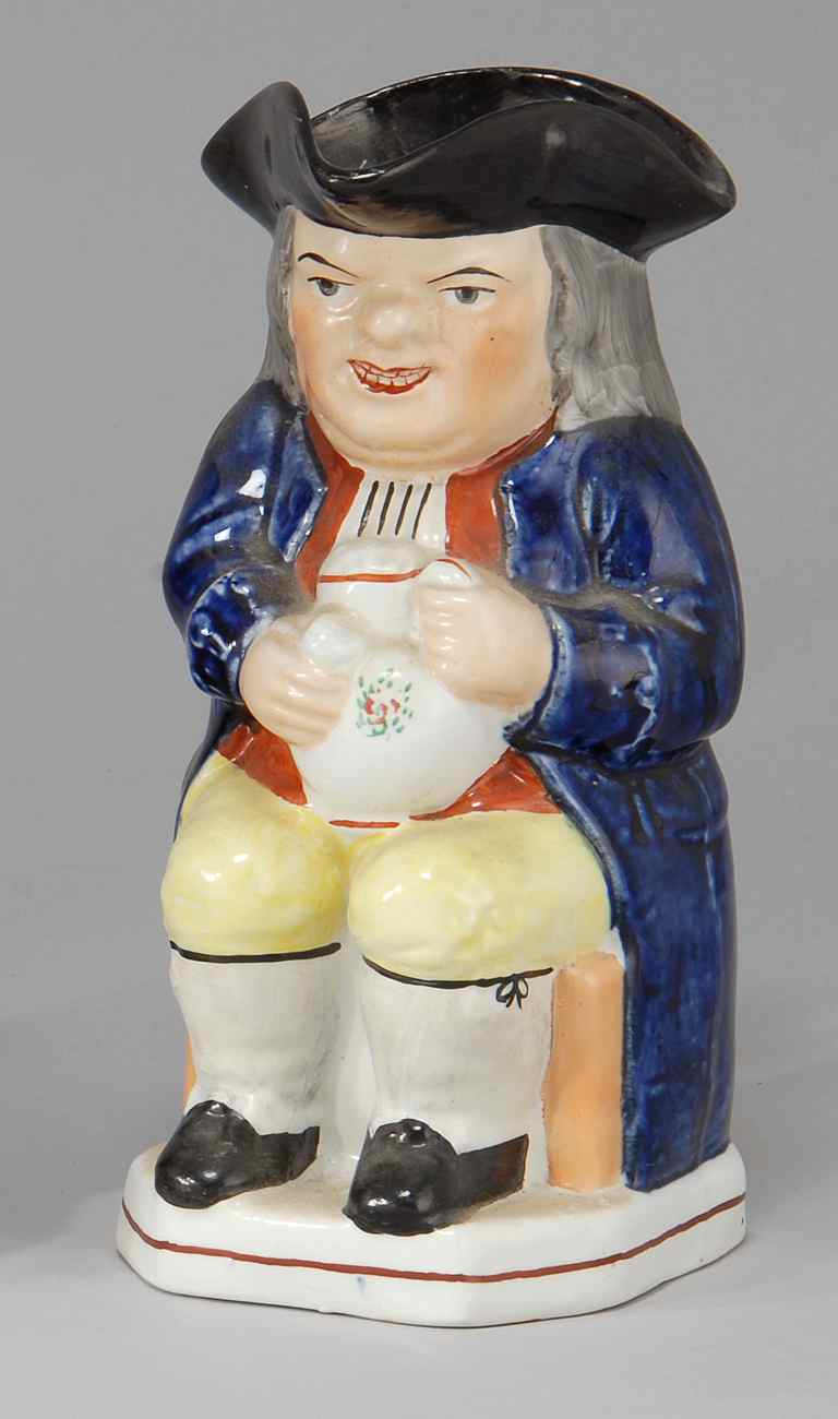 Appraisal: STAFFORDSHIRE TOBY PITCHER th CenturySir Toby Belch holding a pipe