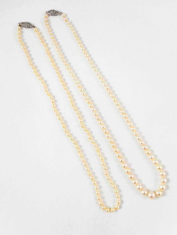 Appraisal: TWO PRINCESS LENGTH WHITE PEARL NECKLACES including a - inch