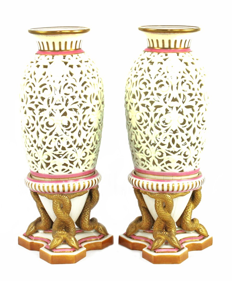 Appraisal: A good pair of porcelain reticulated vases and stands possibly