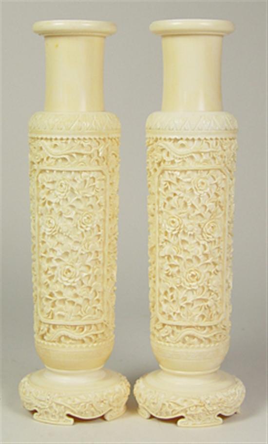 Appraisal: Pair of Carved Ivory Vases On ivory bases Ornately carved