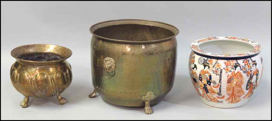 Appraisal: TWO BRASS PLANTERS Together with a porcelain fish bowl Larger