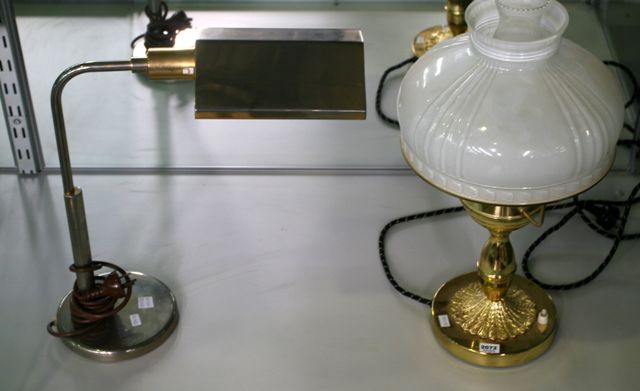 Appraisal: A brass table lamp with milk glass shade together with