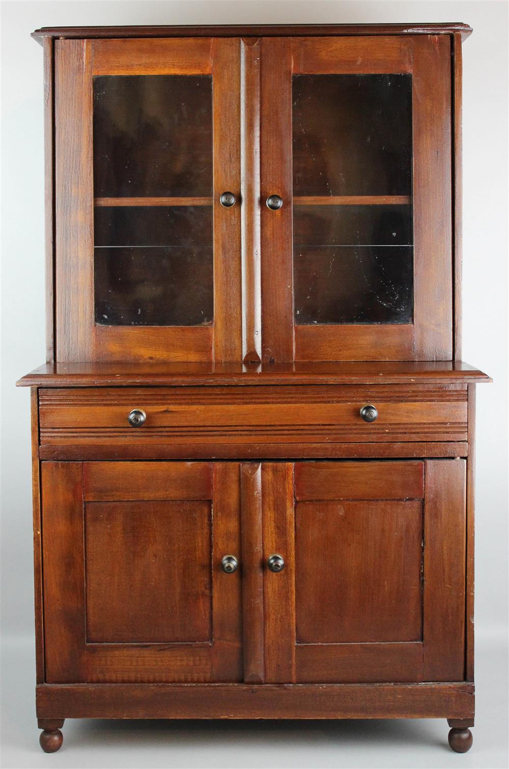 Appraisal: MINIATURE VICTORIAN CHILD'S MAHOGANY BOOKCASE CABINET flat molded cornice above