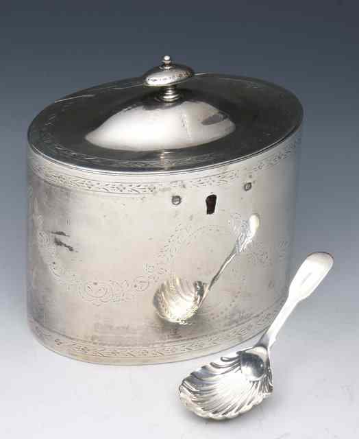 Appraisal: A GEORGE III SILVER TEA CADDY oval shaped with engraved