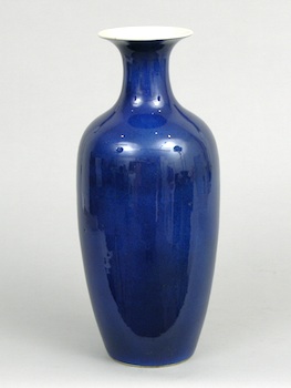 Appraisal: A Tall Monochrome Porcelain Vase Chinese A tall blue monochrome