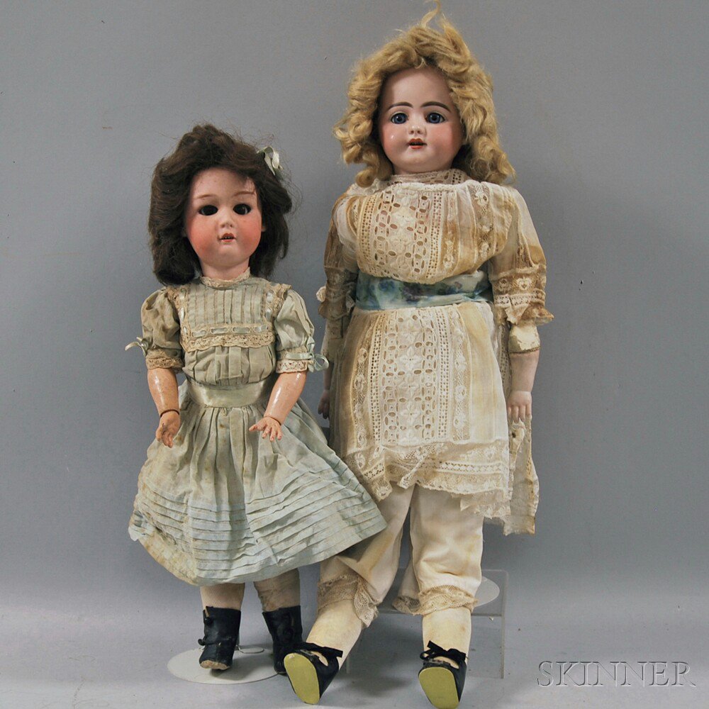 Appraisal: Two German Bisque Head Dolls one a Gebruder Heubach dolly-faced