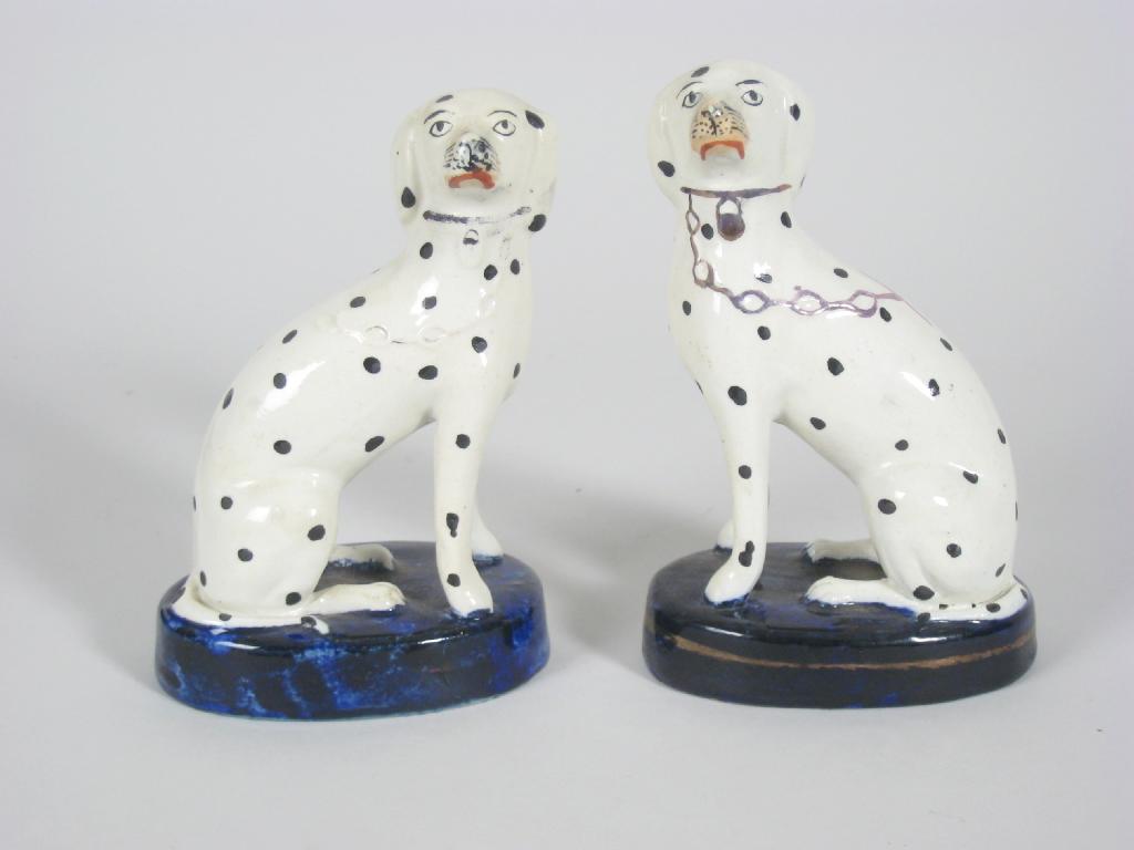 Appraisal: Pair of Staffordshire seated Dalmations on cobalt blue bases in